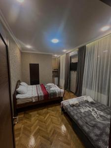Voodi või voodid majutusasutuse Shota's Guest House toas