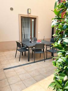 a black table and chairs in a room at Emica's holiday home in Koper +15 photos