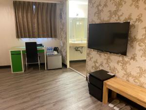 TV a/nebo společenská místnost v ubytování Ximen Relite Hotel