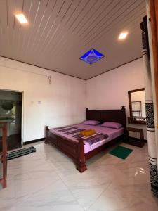 Voodi või voodid majutusasutuse Kurumba Lodge toas
