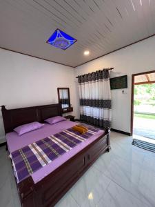 Voodi või voodid majutusasutuse Kurumba Lodge toas