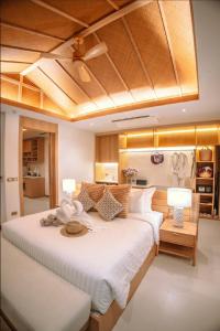Ein Bett oder Betten in einem Zimmer der Unterkunft Luxtalay Khanom Hotel