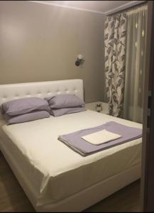 Postel nebo postele na pokoji v ubytování Charming apart next to the beach