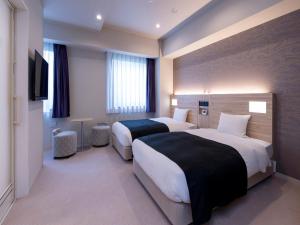 Krevet ili kreveti u jedinici u okviru objekta APA Hotel Kyoto Gojo Omiya