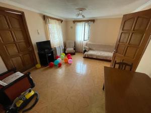 a living room with balloons in the middle of a room at Bata Apartment in Sarpi