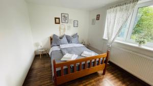 Postel nebo postele na pokoji v ubytování Orličky Apartments
