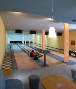 a bowling alley with a lanesetter at Dolce Villa in Prague
