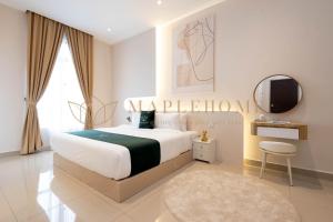 a bedroom with a large bed and a mirror at KSL Residences 2 Premier Suites Johor Bahru in Johor Bahru