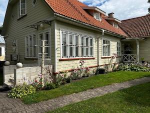 a house with flowers in the front yard at Meil on in Kuressaare