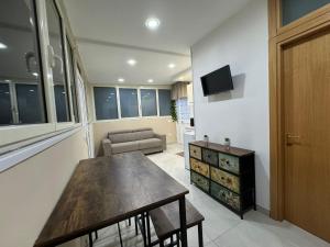 a living room with a table and a couch at B&b Sant'Anna in Ercolano