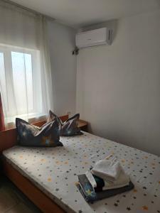 a bedroom with a bed with stars on it at Vila Angelys in Tuzla