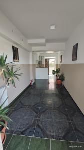 an empty hallway with plants in a room at Casa Tatiana Eforie Nord in Eforie Nord