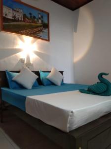 Postel nebo postele na pokoji v ubytování Fionn's Coconut Beach House
