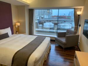 Voodi või voodid majutusasutuse Eastin Taipei Hotel toas