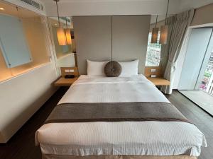 Voodi või voodid majutusasutuse Eastin Taipei Hotel toas