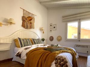 a bedroom with a bed and a window at Encanto en el Moncayo in San Martín de Moncayo