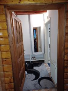 a hallway with a room with a door and a mirror at Apartments Igor in Žabljak +26 photos