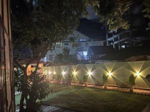 a row of lights on a fence at night at Heritage House Shillong in Shillong