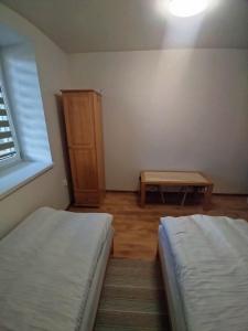 Posteľ alebo postele v izbe v ubytovaní Ubytovanie s kuchynkou