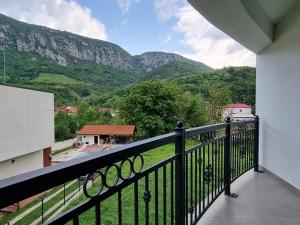 a balcony with a view of a mountain at Pensiunea Maty in Băile Herculane