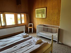 Postel nebo postele na pokoji v ubytování Chalet ALPEN LOTUS