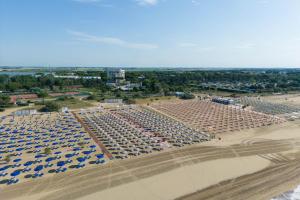 an aerial view of a large parking lot with umbrellas at Laguna Park Hotel 4Superior in Bibione