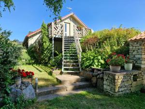 a garden with stairs leading up to a house at Piibelehe Guest Accommodation in Kuressaare