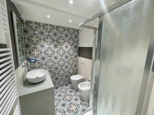 a small bathroom with a toilet and a sink at Dimora Carafa apartment in Lecce