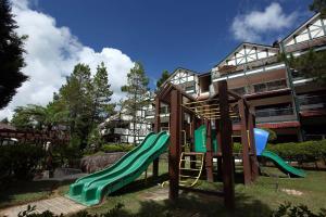 a playground with a slide in front of a building at Zarania Hillhomes in Cameron Highlands