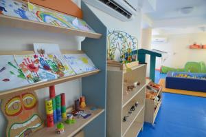 a childs room with toys on shelves at Laguna Park Hotel 4Superior in Bibione