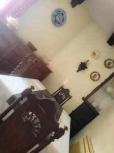 an aerial view of a room with clocks on the wall at Maison atypique in Tende