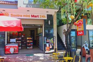 a store front of a store with alimit mat sign at Sontra Sea Hotel in Danang