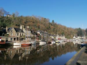 a group of boats are docked in a harbor at La Tocade Del Arte - Dinan in Lanvallay