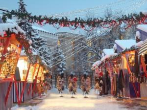 a group of people riding bikes down a snow covered street at Cheap And Chic in Rīga