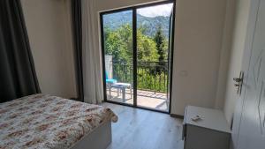 Postel nebo postele na pokoji v ubytování Hotel Palm Gonio