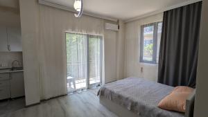 Voodi või voodid majutusasutuse Hotel Palm Gonio toas