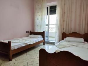 Postel nebo postele na pokoji v ubytování Koshi Home