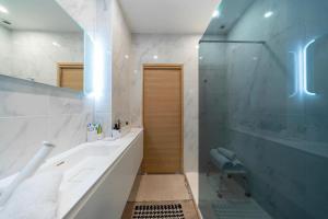 a bathroom with a tub and a sink and a shower at Elegant duplex, very well equipped, close to shops in Cannes
