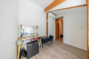 a living room with a desk and a mirror at Elegant duplex, very well equipped, close to shops in Cannes +9 photos