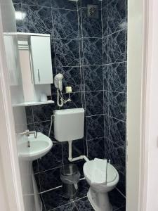 Koupelna v ubytování Hotel Azzurro
