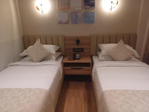 Postel nebo postele na pokoji v ubytování Hotel Raai Hosur + 28 fotografií