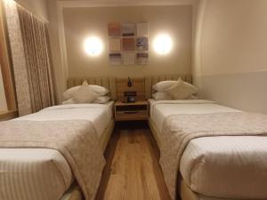 Postel nebo postele na pokoji v ubytování Hotel Raai Hosur