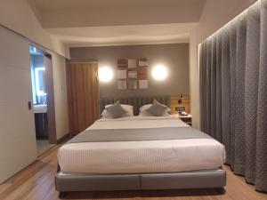 Postel nebo postele na pokoji v ubytování Hotel Raai Hosur