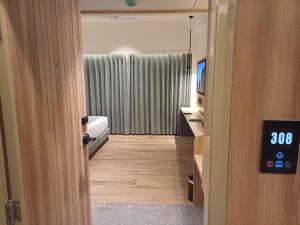 Postel nebo postele na pokoji v ubytování Hotel Raai Hosur
