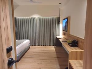 Postel nebo postele na pokoji v ubytování Hotel Raai Hosur