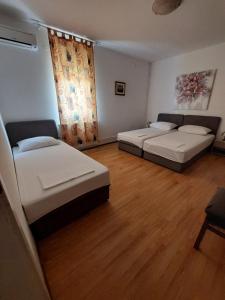 Postel nebo postele na pokoji v ubytování Villa Vilma