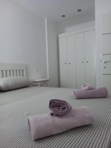 Ένα ή περισσότερα κρεβάτια σε δωμάτιο στο Aloha Guest House
