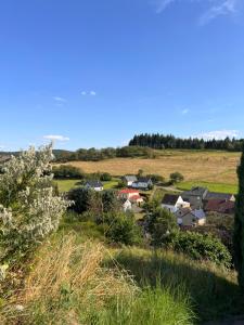 a small town in a field with houses at Ferienwohnung am Nürburgring in Siebenbach