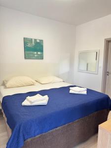 Posteľ alebo postele v izbe v ubytovaní Apartment Gitara