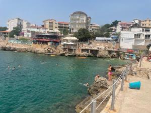 a group of people in the water at a beach at Morski plamen in Kruče +5 photos